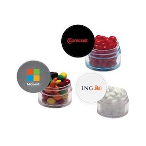 Twist top container with blue cap filled with cinnamon red hots - Twist top container with blue cap filled with cinnamon red hots